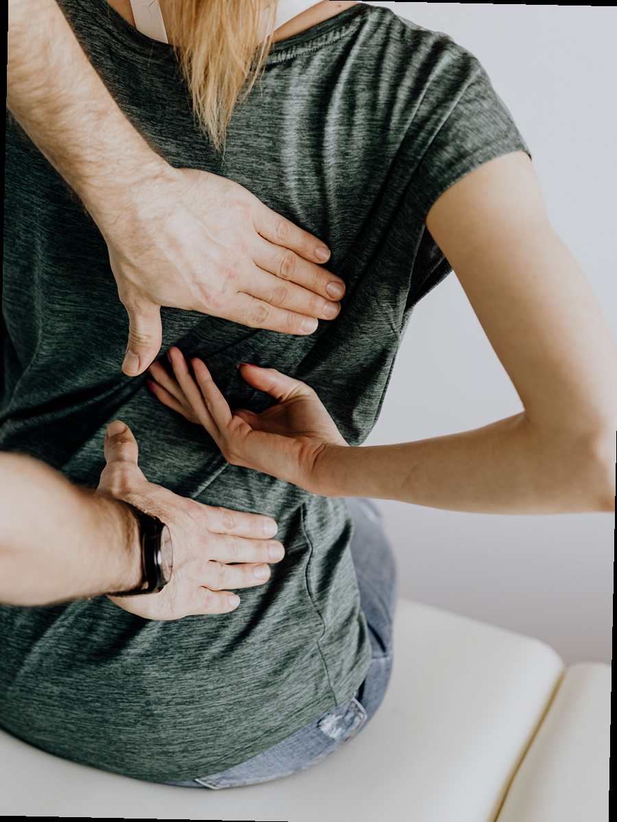 Patient and healthcare professional discussing spine treatment options